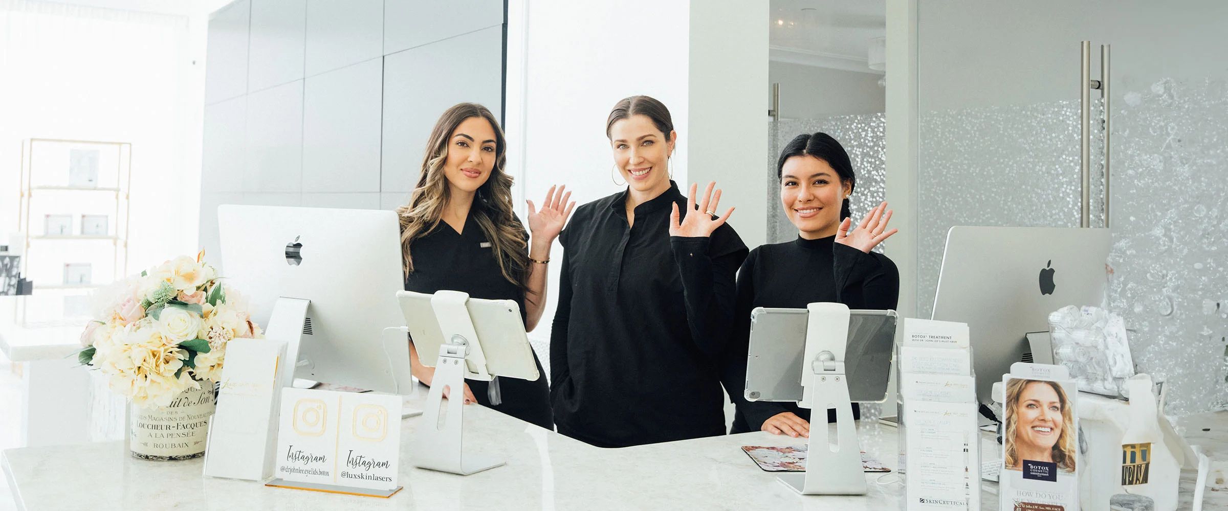 The Lux Skin & Lasers team welcoming patients at the front desk