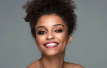 face of a cheerful beautiful Afro-American woman