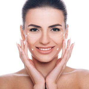 smiling woman with lifting arrows on face concept of skin lifting picture id1139925115 300x300